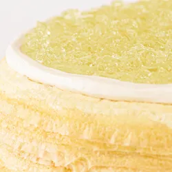 Detail shot of Lady M's Champagne Mille Crêpes. Layers of crêpe, cream, and champagne gelée.
