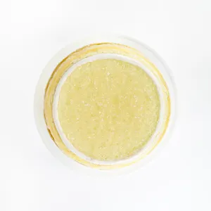 A top-down shot of a Lady M Champagne Mille Crêpes on top a white cake stand.