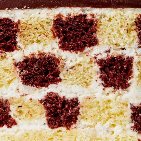 Detail shot of Lady M's Checkers. Layers of vanilla and chocolate sponge cake.