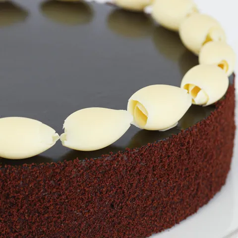 Detail shot of Lady M's Couronne du Chocolat. Layers of sponge cake, mousse, and chocolate ganache.