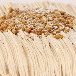 Detail shot of Lady M's Gâteau aux Marrons. Layers of whipped cream, chestnut cream, and walnuts.