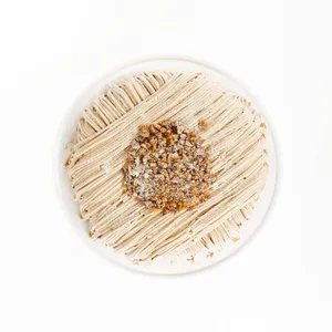 A top-down shot of a Lady M Gâteau aux Marrons on top a white cake stand.