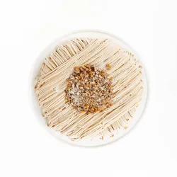A top-down shot of a Lady M Gâteau aux Marrons on top a white cake stand.