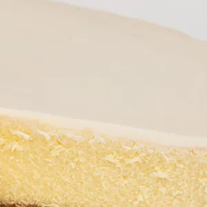 Detail shot of Lady M's Gâteau Nuage. Layers of graham crust, cheesecake, and sweetened sour cream.