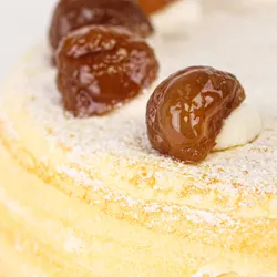 Detail shot of Lady M's Marron Mille Crêpes. Layers of crêpe, cream, and glazed chestnut.
