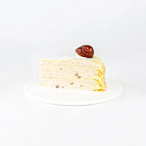 A Lady M Marron Mille Crêpes slice on top a white round plate.