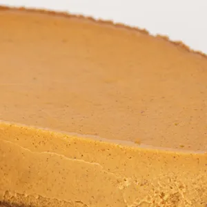 Detail shot of Lady M's Pumpkin Nuage. Layers of graham cracker base and pumpkin cheesecake.