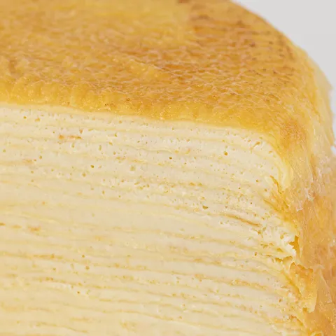 Detail shot of Lady M's Signature Mille Crêpes. Layers of crêpe, and pastry cream.