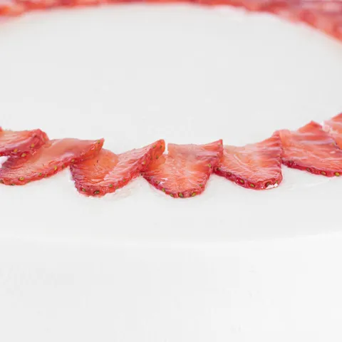 Detail shot of Lady M's Strawberry Shortcake, layers of sponge cake, cream, and strawberries.