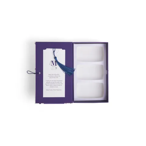 A thumbnail shot of an open Lady M 3-piece "The Brownstone" Box Bon Bon Book.