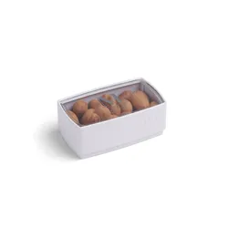 A Lady M Crème Brûlée Bon Bons encased inside a packaging with a Lady M logo.