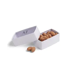 A half-open packaging with a Lady M Crème Brûlée Bon Bons inside.