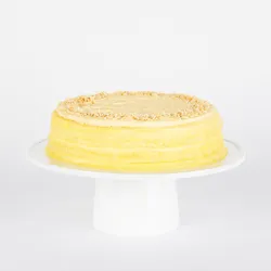 A thumbnail shot of a Lady M Tres Leches Mille Crêpes on top a white cake stand.