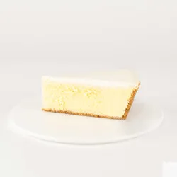 A thumbnail shot of a Lady M Gâteau Nuage slice on top a white round plate.