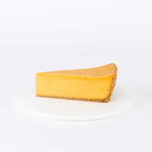 A thumbnail shot of a Lady M Pumpkin Nuage slice on top a white round plate.