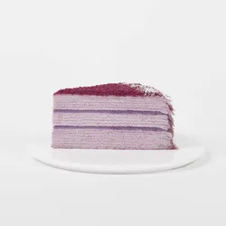 A thumbnail shot of a Lady M Purple Yam Mille Crêpes slice on top a white round plate.