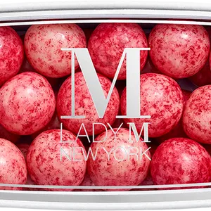 A thumbnail shot of a Lady M Lychee Fruit Jelly encased inside a packaging with a Lady M logo.