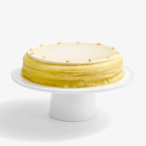 A thumbnail shot of Lady M Dassai Blue Mille Crêpes, on top a white cake stand.