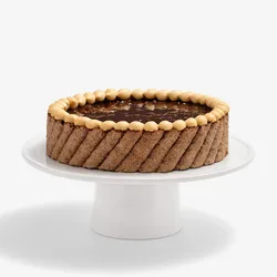 A thumbnail shot of a whole Lady M's Noisettes Chocolat cake, on top of a white cake stand.