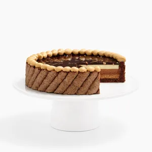 A thumbnail shot of Lady M's Noisettes Chocolat cake sliced into, on top of a white cake stand.