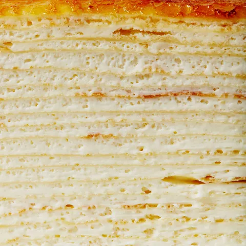 A detail shot of Lady M's Signature Mille Crêpes. Layers of crêpes and pastry cream.