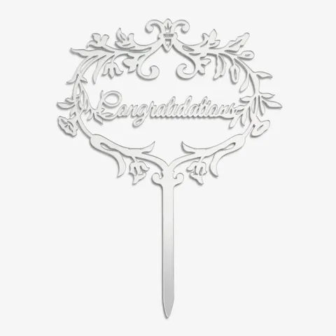 Close-up shot of Lady M's silver Cake Topper spelling out the words: "Congratulations".