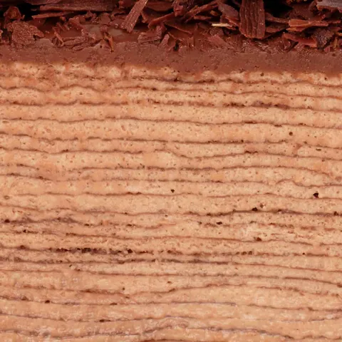 Detail shot of Lady M's Amedei Chocolate Mille Crêpes. Layers of chocolate crêpes and pastry cream.