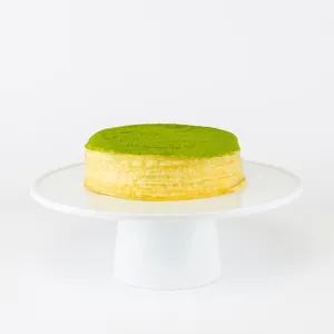 Lady M's 6-inch Green Tea Mille Crêpes: thin crêpes, green tea pastry cream, green tea powder. 