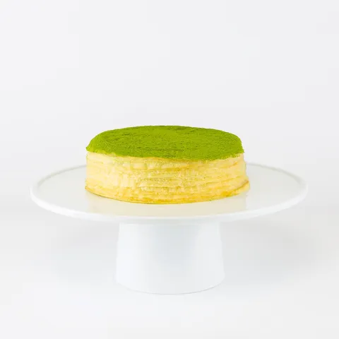 Lady M's 6-inch Green Tea Mille Crêpes: thin crêpes, green tea pastry cream, green tea powder.