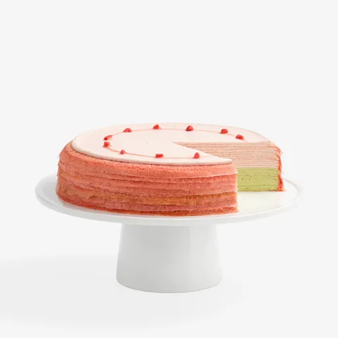 Lady M's Strawberry Matcha Mille Crêpes: pink crêpes, strawberry cream, matcha cream, strawberry glaze, strawberry pieces.