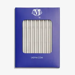 Silver Lady M candles in blue box on white background.