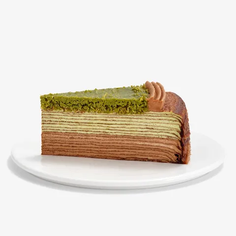 A slice of Lady M's Dubai Chocolate Mille Crêpes with chocolate, pistachio & knafeh.