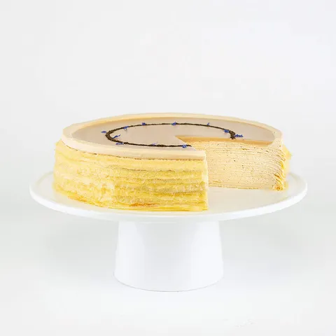 Lady M's Earl Grey Mille Crêpes: layers of crêpes and Earl Grey pastry cream, topped with tea glaze and blue cornflowers.