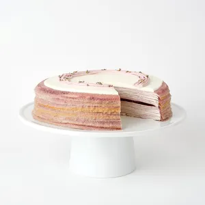 Lavender Mille Crêpes: paper-thin crêpes, lavender cream, blackberry jelly center, lavender flowers, lavender-blackberry piping.