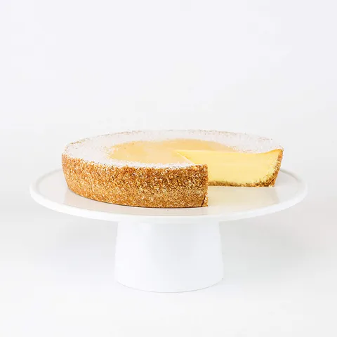 Lady M's Passion Fruit Cheesecake: creamy cheesecake with passion fruit puree, coconut graham crust, and snow sugar.
