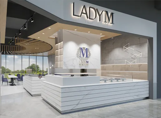 Lady M Taichung LaLaport Store in Taichung with backlit LADY M signage above the entrance. The sleek interior features white striped counters, a blue Lady M logo on marble walls, and a contemporary design with wooden ceiling elements. Large windows provide natural light, and purple seating is visible in the dining area.
