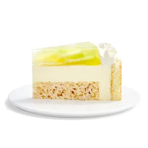 A single slice of Lady M's Charlotte au Melon cake, showing layers of cake, cream, and melon jelly.
