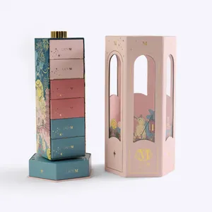 A Lady M lantern, open to show the inner stack of small, colorful illustrated boxes.