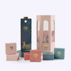 A Lady M lantern gift set with the packaging and small, individual pink and blue boxes displayed.