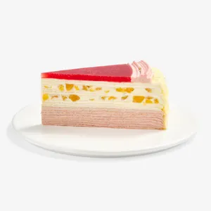 A slice of Peach Melba Mille Crêpes on a plate, showing its peach filling and red jelly top.
