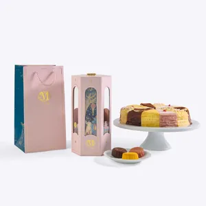 Lady M Mid-Autumn Gift Box, shopping bag, and a Slice of the Best crepe cake on a white background.