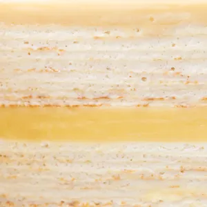 Close-up of Lady M's Jasmine Calamansi Mille Crêpes with layers of crepes and bavarois cream.