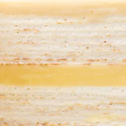 Close-up of Lady M's Jasmine Calamansi Mille Crêpes with layers of crepes and bavarois cream.