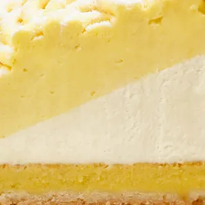 Closeup image of Lady M's Sweet Corn Tart showing mousse, cream, and crust layers.
