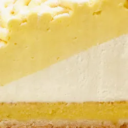 Closeup image of Lady M's Sweet Corn Tart showing mousse, cream, and crust layers.