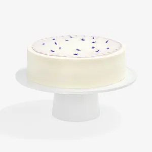 A Lady M Taro Mochi Cream Cake set on top a white cake stand.