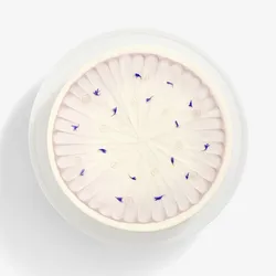 A top-down shot of a Lady M Taro Mochi Cream Cake set on top a white cake stand.