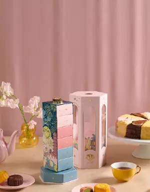 A lifestyle photo of Lady M's Jade Rabbit Lantern Gift Set with cake slices.