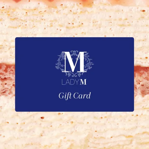 Image of Lady M Gift Card over a close-up shot of a Lady M crepe cake.