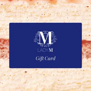 Image of Lady M Gift Card over a close-up shot of a Lady M crepe cake.